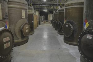 line of brown industrial tanks